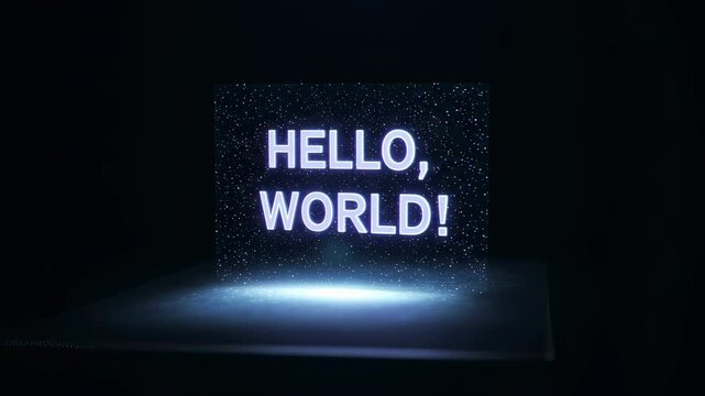 Hello world text appears as a hologram on a dark background. Coding program beginning and digital technology concept footage.