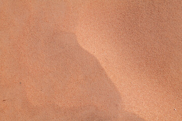 sand from red Aztec Sandstone outcrops, Early Jurassic geological formation of primarily eolian sand. Rainbow Vista Trailhead, Valley of Fire State Park, Clark County, Nevada geology. Weathering.