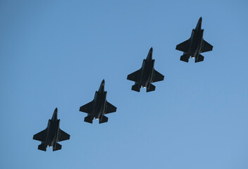 Four F-35 stealth fighter jets in formation during a NATO exercise by the Dutch airforce