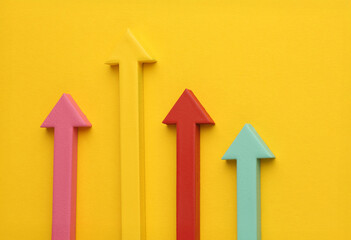 Multicoloured arrows pointing up and down. Symbolise growth progress, success in business finance. Rising bars of graphs represent market trends, return on investment, business development, financial