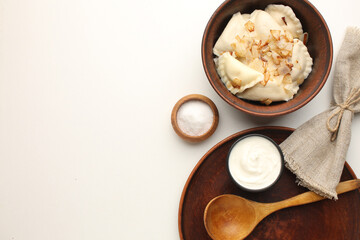 Traditional Ukrian food dumplings and sour cream