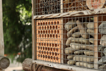 Insect houses. Wooden insect house for pest control and pollination of plants. House for beneficial insects © Mariia