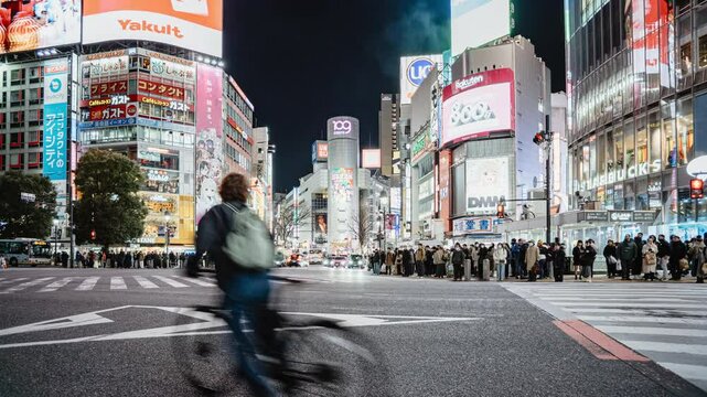 Tokyo, Japan - Feb 13, 2025 : 4K Timelapse view of the iconic Shibuya crossing at night in Shibuya City, central Tokyo, Japan.