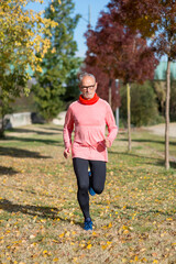 Senior man running outdoors in sportswear