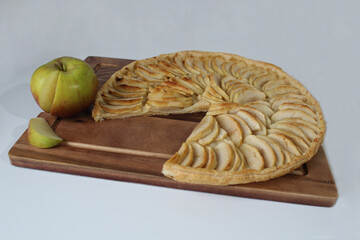 Thin crispy apple pie on puff pastry base