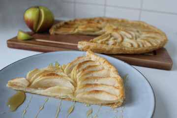 Thin crispy apple pie on puff pastry base