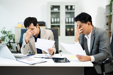 Frustrated manager scolds employee in office over financial error. Concept of workplace stress, reporting issues, conflict