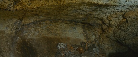 Pov view on rock formations.The cave excursion with natural landscape and ancient walls viewed in first person.The cave attraction landmark for tourists seeking adventure and unique travel experience