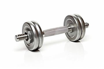 Naklejka premium Dumbbell lying on a flat surface with a shiny finish reflecting light in a gym setting