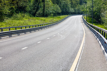A long, empty road with a white line down the middle