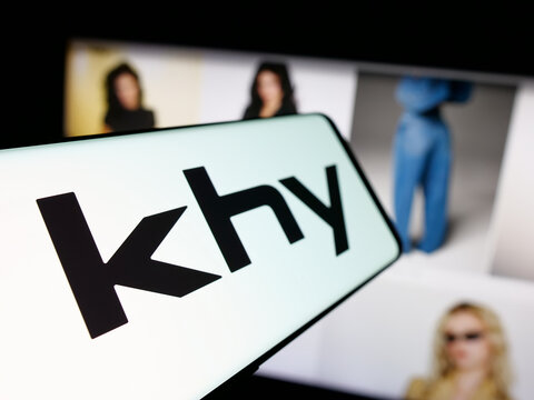 Stuttgart, Germany - 05-25-2025: Smartphone with logo of US fashion company K Brand Inc. (Khy) on screen in front of website. Focus on left of phone display.