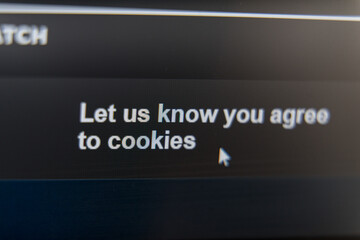 Close-up of a website message asking for cookie consent with a cursor pointing to the text.