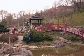 Serene Japanese Garden with Red Bridge in Uman