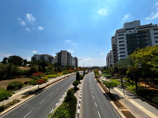 New buildings, green area around apartment buildings. Modern city in Israel.