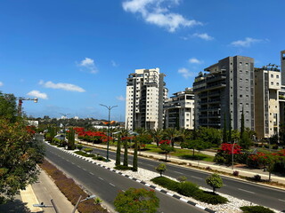 New buildings, green area around apartment buildings. Modern city in Israel.