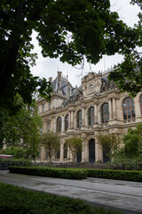 Naklejka premium Majestic Historic Building Framed by Green Trees