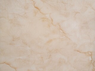 The visual background of the marble surface is elegant, natural, and a little classic, with variations of cream and brown colors, and there are streaks creating a natural impression like stone fibers.