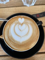 cup of coffee on wooden table