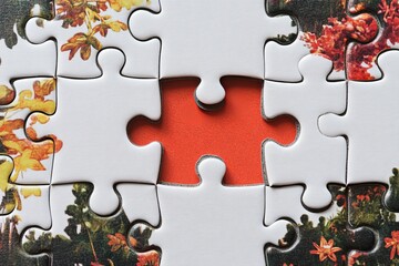 close up puzzle with one piece apart
