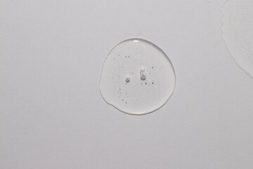 Top view of trasparent  circule dropl place, serum toner cream swatch texture