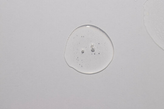 Top view of trasparent  circule dropl place, serum toner cream swatch texture