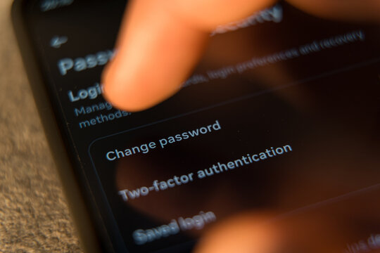 finger tapping the Change password option in a smartphone security settings menu