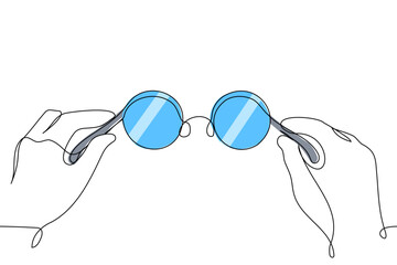 Human hands holding round blue glasses close up - one line art vector. round round glasses frame with colored lenses