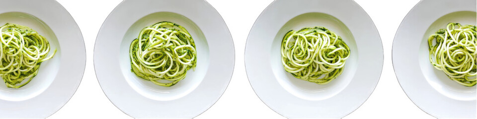 Zucchini noodles on white plates