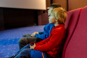 Family with children and pet dog, visiting Nordkapp during the summer holiday