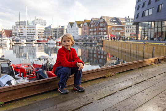 Cute preschool child, boy, on  a sunny day in Tromso, visiting the bigest northern city in Northern Norway