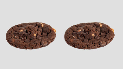 A large chocolate cookie topped with chocolate chips, set against a white background.