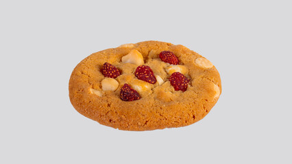 Vanilla cookies topped with nuts and strawberries on a white background