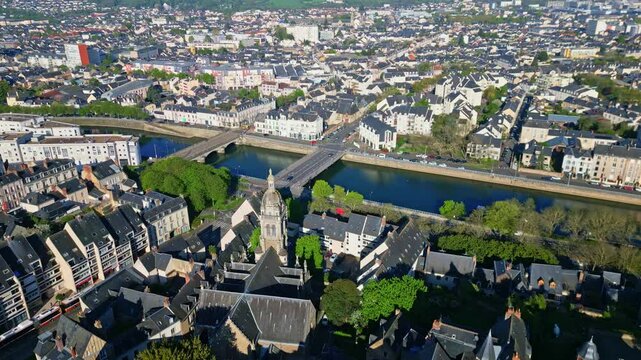 St Benoit Church, Pont Perrin over Sarthe river, and Le Mans cityscape, France. Aerial backward