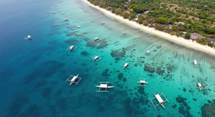 Tropical beach boats aerial view