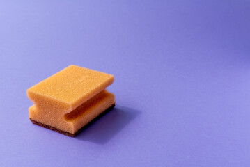 one yellow sponge on the violet background.