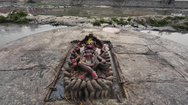 Ancient Vishnu Stone Sculpture Carved on Riverbank Surface Near Pashupatinath Temple in Kathmandu Nepal