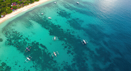 Turquoise ocean with boats and coral reefs