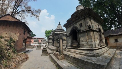 Obraz premium Collection of Votive Stupas and Small Shrines in the Mrigasthali Temple Area, Located in the Hills Above Pashupatinath Temple, Kathmandu, Nepal – Showcasing Rich Architectural Heritage and Spiritual S