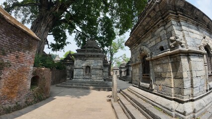 Naklejka premium Collection of Votive Stupas and Small Shrines in the Mrigasthali Temple Area, Located in the Hills Above Pashupatinath Temple, Kathmandu, Nepal – Showcasing Rich Architectural Heritage and Spiritual S