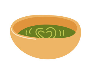 Warm green soup in a bowl with heart design on top