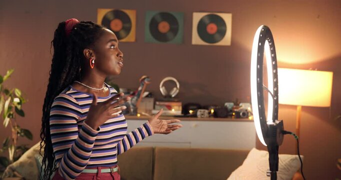 Live streaming, ring light and wave with black woman in home for influencer, production or smile. Social media content creator or recording with person and phone for vlog broadcast or follower advice