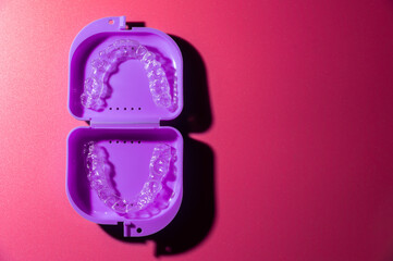 Transparent aligners and storage case. Invisible braces. Clear teeth straighteners. plastic bracers ready to use