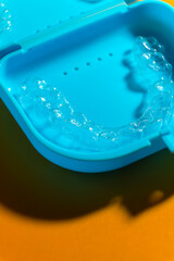 Transparent aligners and storage case. Invisible braces. Clear teeth straighteners. plastic bracers ready to use