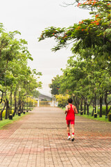 Runner man athlete jogging in the park.