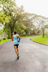 Runner man athlete jogging in the park.