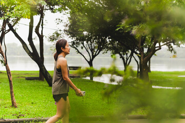 Middle aged woman walking in the park.