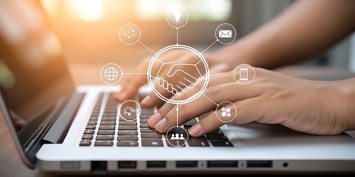 Person using laptop computer with digital icons representing global business partnership and collaboration