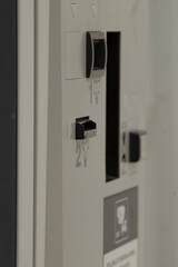 Image of a control panel featuring various knobs and switches for operational use in machines or...