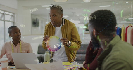 Image of financial data and graphs over diverse female and male coworkers in office