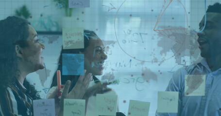 Image of world map and globe over diverse business people